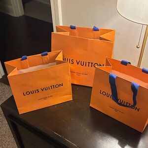 Louis Vuitton Bold Orange Bags with Blue Handles
